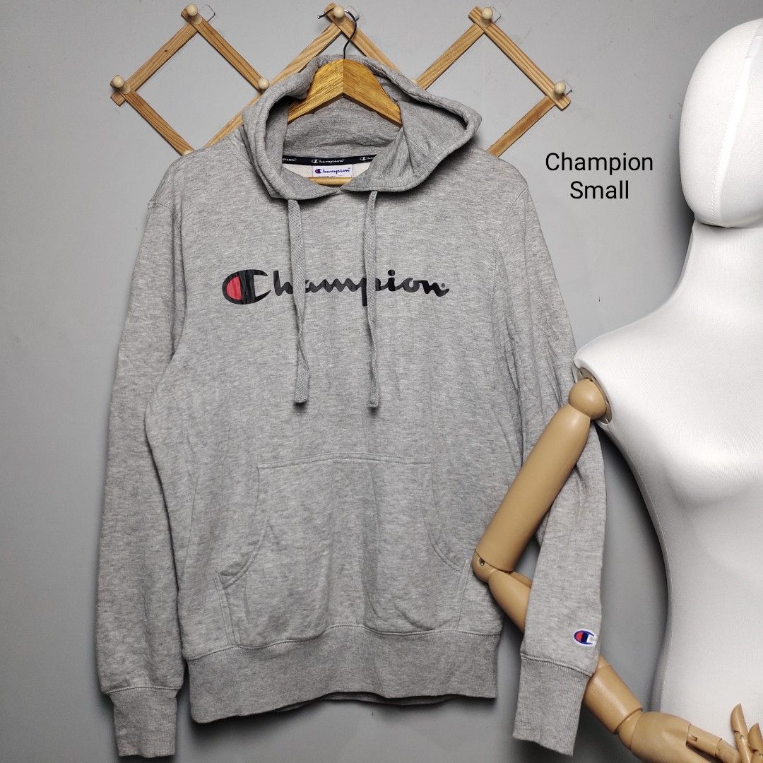 Champion Gray Hoodie Small (Category: Hoodies) located in Tayabas. Submitted by lorrena (Listing ID 1466963051, Image 1). Description: - Brand: Champion - Color: Gray - Size: Small (fits true to size) - Design: Classic script logo on chest with embroidered wrist patch - Features: Kangaroo front pocket, adjustable hood drawstrings, ribbed hem and cuffs - Condition: Excellent, warm and cozy fabric.