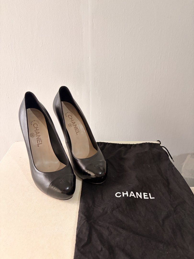 Chanel Black Leather Cap-Toe Heels (Category: Heels) located in Makati City. Submitted by nearlynewbyrosie (Listing ID 1466799325, Image 1). Description: - Brand: Chanel - Style: Black leather pumps with shiny patent cap toes & CC logo - Size: 37 (Made in Italy) - Condition: Normal scuffing on wooden soles and minor wear on heel tips - Inclusions: Original black Chanel dust bag - Perfect for work, events, and everyday chic! - Price is negotiable 