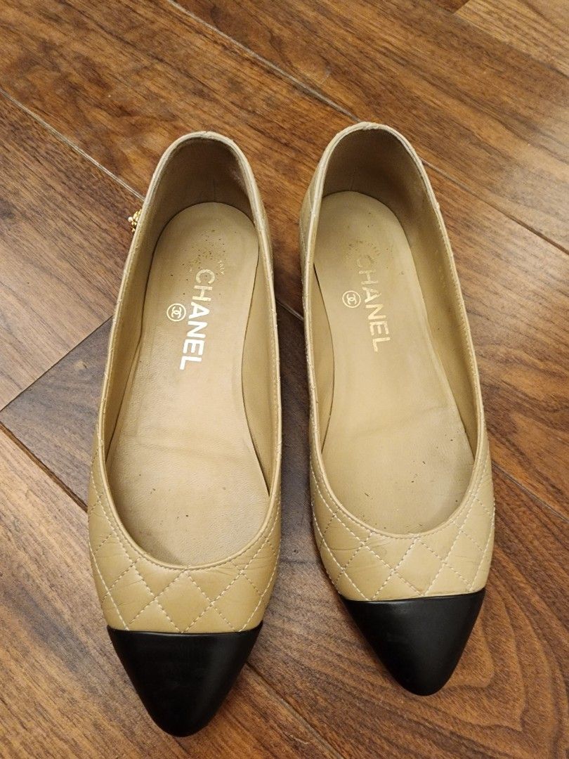 Chanel Quilted Cap-Toe Ballet Flats Beige Black (Category: Flats & Sandals) located in Manila. Submitted by wardrobemanila (Listing ID 1466846514, Image 1). Description: Bought in chanel store abroad, authentic! this is my personal shoes. used na ito, un isa pearl sa camellia flower nawala, pero ok na ok pa rin and also this is Chanel. Selling super duper low just to dispose, also matagal ko lang na store sa cabinet, matagal hindi nagamit so mata