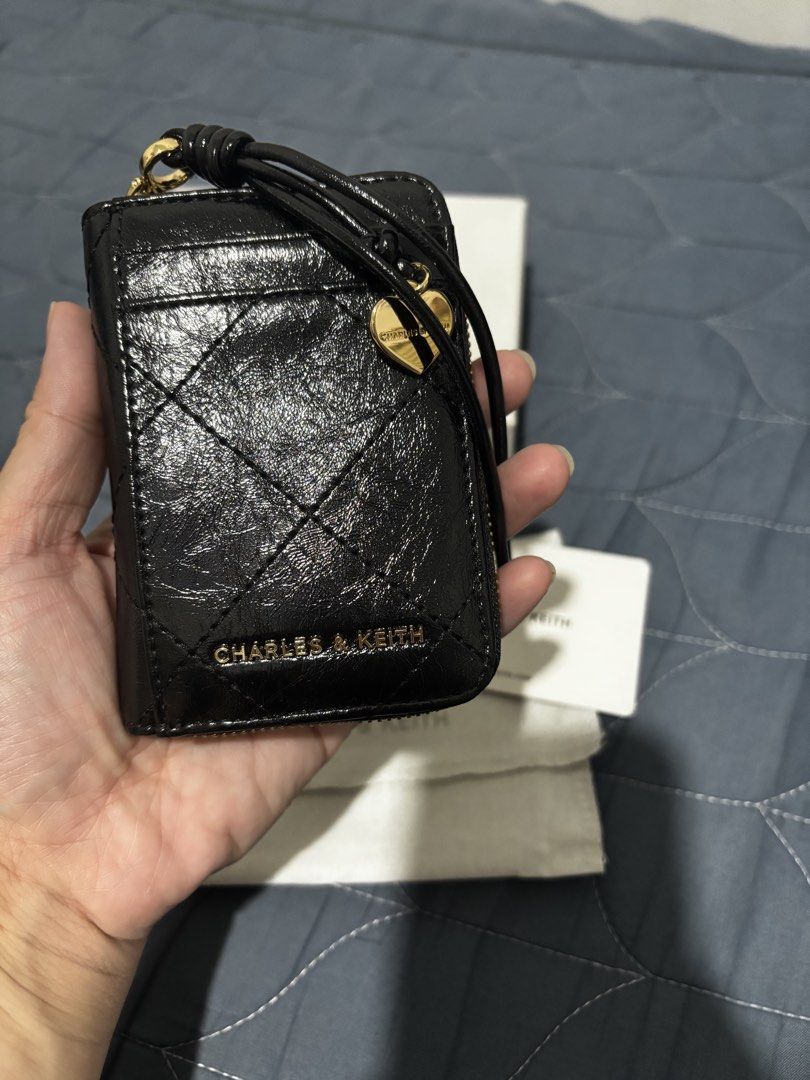 Charles & Keith Apfra (Category: Wallets & Card holders) located in Manila. Submitted by declutter_byjaq (Listing ID 1466930358, Image 2). Description: Charles & Keith Apfra CK6-10681250 Colour: Black In excellent condition Good as New Used twice only Impulsive buy RFS: Needs Cash.