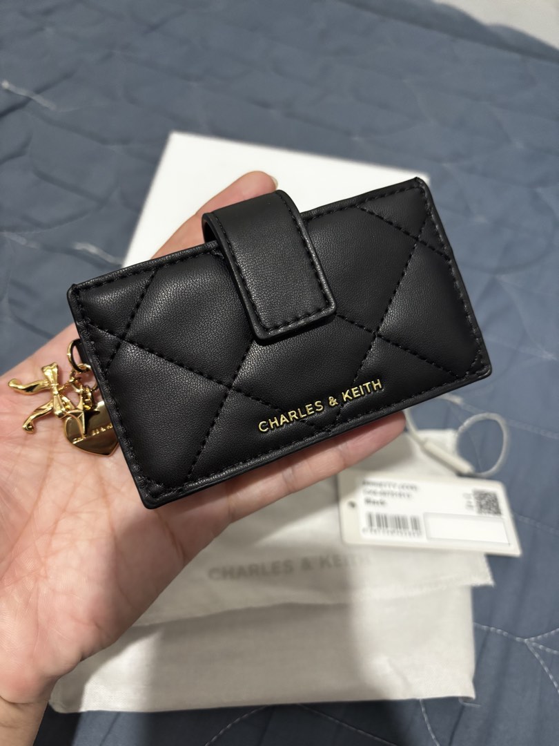 Charles & Keith Arrietty (Category: Wallets & Card holders) located in Manila. Submitted by declutter_byjaq (Listing ID 1466931768, Image 2). Description: CHARLES & KEITH ARRIETTY Details: Brand: Charles & Keith Style: Arrietty Style Code: CK6-50701613 Colour: Black Condition: Excellent Condition Usage: Used once only — good as new! A classy and timeless black card holder that's perfect for everyday use or special occasions. Elegant, versatile, a