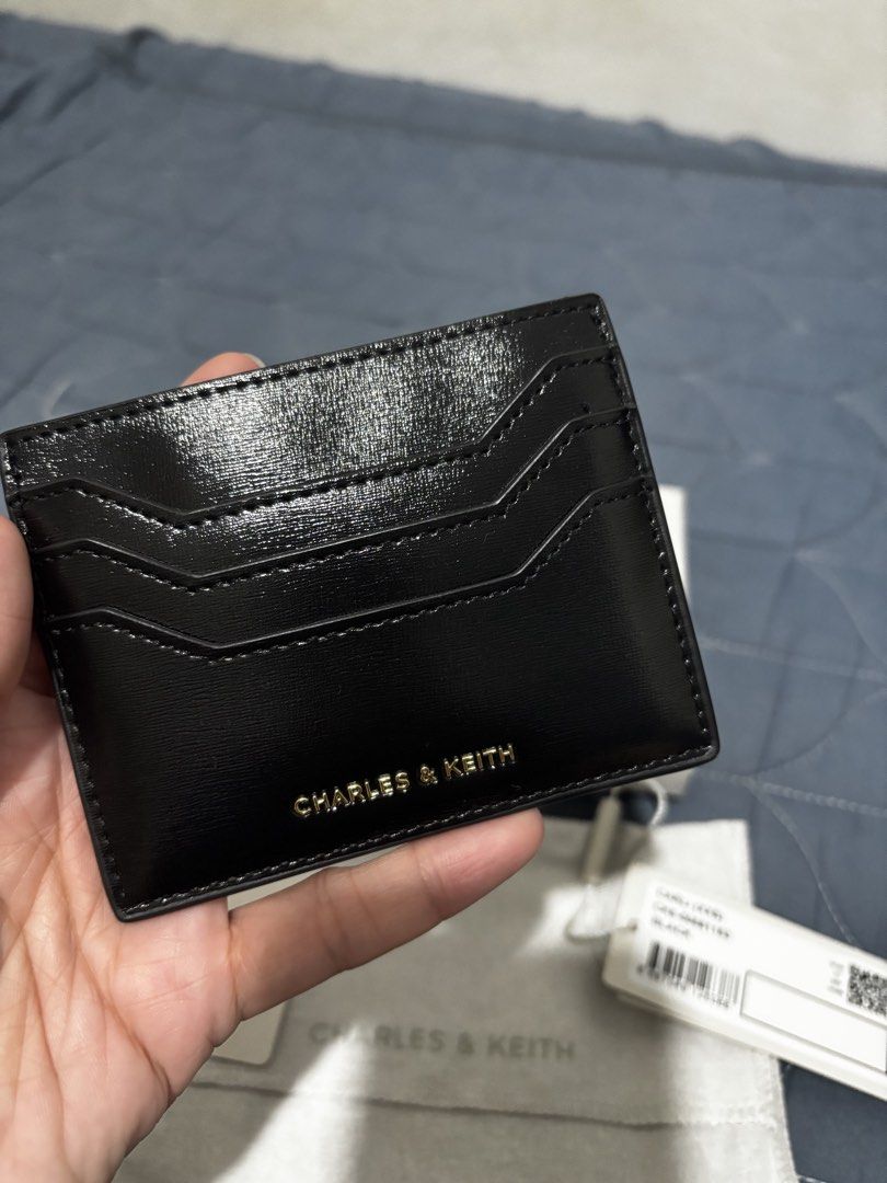 Charles & Keith Carli (Category: Wallets & Card holders) located in Manila. Submitted by declutter_byjaq (Listing ID 1466933118, Image 2). Description: CHARLES & KEITH CARLI Details: Brand: Charles & Keith Style: Carli Style Code: CK6-50681163 Colour: Black Condition: Brand New Never been used! Bought on impulse, but super liit niya pala for me. 😅 Sayang naman kung nakatago lang, kaya letting this beauty go to a new owner! Classic black, elegant