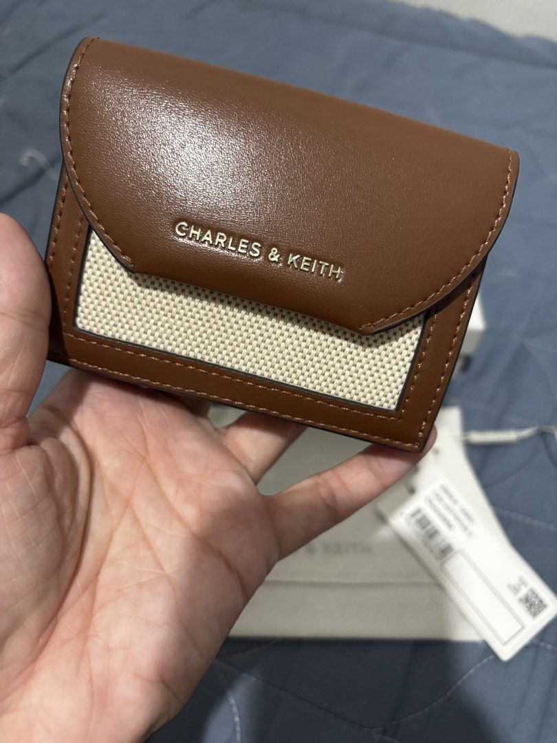 Charles & Keith Enola (Category: Wallets & Card holders) located in Manila. Submitted by declutter_byjaq (Listing ID 1466929429, Image 2). Description: CHARLES & KEITH ENOLA Details: Brand: Charles & Keith Style: Enola Style Code: CK6-10770715-1 Colour: Chocolate Condition: Excellent Condition Usage: Used thrice only — good as new! Chic, classy, and timeless! The beautiful chocolate colour makes this wallet easy to match with your favourite bags 
