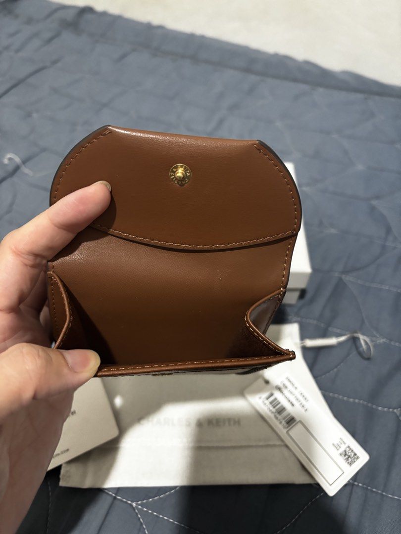 Charles & Keith Enola (Category: Wallets & Card holders) located in Manila. Submitted by declutter_byjaq (Listing ID 1466929429, Image 3). Description: CHARLES & KEITH ENOLA Details: Brand: Charles & Keith Style: Enola Style Code: CK6-10770715-1 Colour: Chocolate Condition: Excellent Condition Usage: Used thrice only — good as new! Chic, classy, and timeless! The beautiful chocolate colour makes this wallet easy to match with your favourite bags 