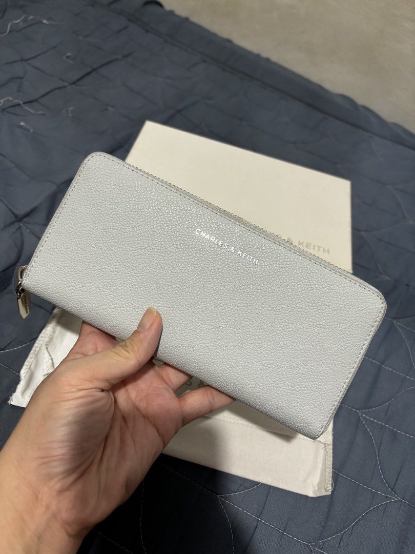 Charles & Keith Long Wallet (Category: Wallets & Card holders) located in Manila. Submitted by declutter_byjaq (Listing ID 1466926930, Image 3). Description: CHARLES & KEITH LONG WALLET Details: Brand: Charles & Keith Style Code: CK6-10770552-1 Colour: Sea Salt Blue Condition: Excellent Condition — good as new! Elegant, classy, and effortlessly chic! The beautiful Sea Salt Blue shade adds a soft, sophisticated touch to your everyday essentials. P