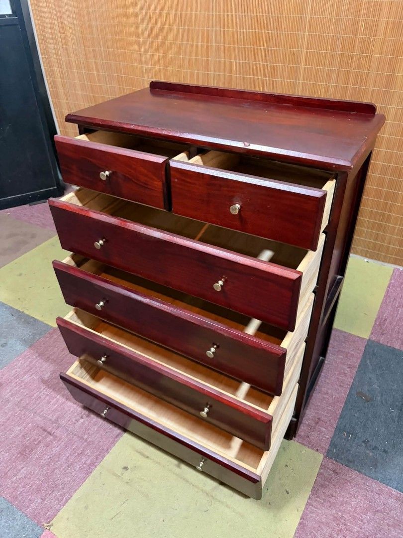 Chest Drawer (Category: Shelves, Cabinets & Racks) located in Meycauayan. Submitted by marygracecasimiro (Listing ID 1466893211, Image 2). Description: SOLID WOOD Classic Mahogany Side Drawer A LIVING ROOM MUST HAVE!!! A dark reddish-brown wooden chest of drawers (tallboy dresser) featuring a 6-drawer layout with two small top drawers and four larger lower drawers with round metal pulls. Price : 4500 ✅ 25L x 13W x 31H inches In VERY good conditio