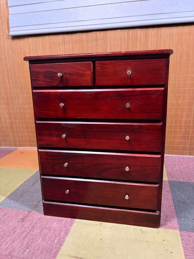 Chest Drawer (Category: Shelves, Cabinets & Racks) located in Meycauayan. Submitted by marygracecasimiro (Listing ID 1466893211, Image 1). Description: SOLID WOOD Classic Mahogany Side Drawer A LIVING ROOM MUST HAVE!!! A dark reddish-brown wooden chest of drawers (tallboy dresser) featuring a 6-drawer layout with two small top drawers and four larger lower drawers with round metal pulls. Price : 4500 ✅ 25L x 13W x 31H inches In VERY good conditio