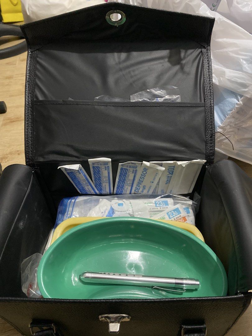CHN BUNDLE Medical Kit with Stethoscope and Instruments (Category: Medical Supplies & Tools) located in Binan City. Submitted by sellerygirl19 (Listing ID 1466919777, Image 2). Description: - Complete medical instrument set in a stylish black leatherette carry bag - Includes blue stethoscope, tongue depressors, and 23G needles - Comes with green and yellow kidney basins, cord clamps, and various sterile supplies - Ideal starter kit for nursing or
