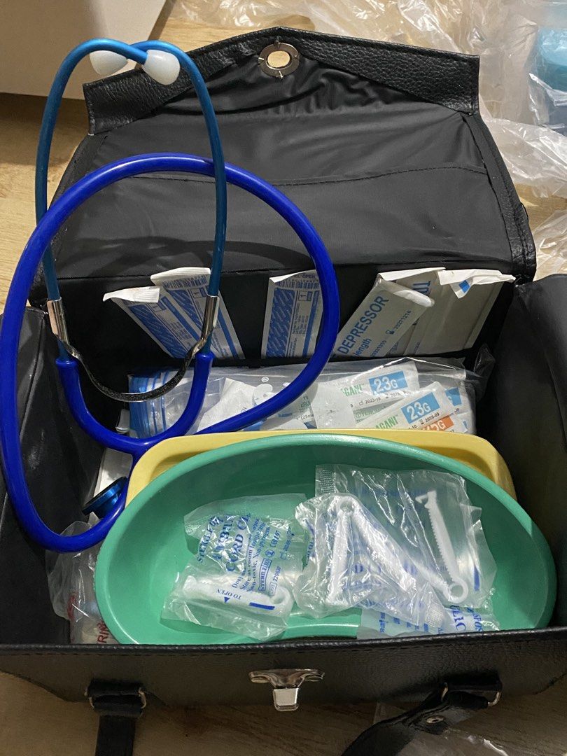 CHN BUNDLE Medical Kit with Stethoscope and Instruments (Category: Medical Supplies & Tools) located in Binan City. Submitted by sellerygirl19 (Listing ID 1466919777, Image 1). Description: - Complete medical instrument set in a stylish black leatherette carry bag - Includes blue stethoscope, tongue depressors, and 23G needles - Comes with green and yellow kidney basins, cord clamps, and various sterile supplies - Ideal starter kit for nursing or
