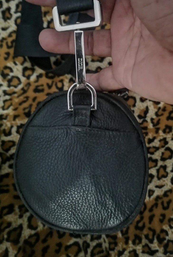 Christian Dior Atelier roller bag (Category: Sling Bags) located in Cebu City. Submitted by roadthrift (Listing ID 1466782808, Image 3). Description: Highlights black cylindrical shape leather zip fastening adjustable shoulder strap logo print Condition: Lightly used. .