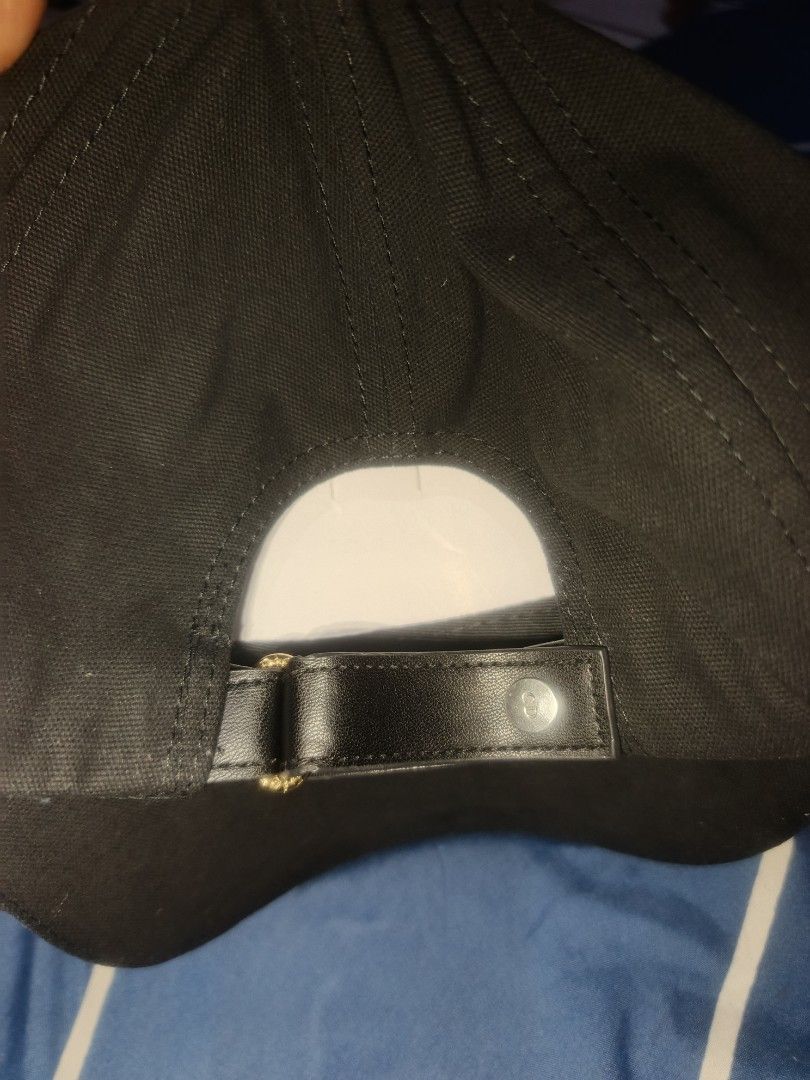 Christian Dior Black Embroidered Baseball Cap (Category: Caps & Hats) located in Manila. Submitted by julianivan50757 (Listing ID 1466954192, Image 3). Description: Black baseball cap from Christian Dior. Bold embroidered DIOR lettering across the front. Adjustable leather strap closure at the back with metal hardware and CD logo. Interior features Christian Dior Boutique Paris tag and cotton-coton care label. Classic six-panel construction with 