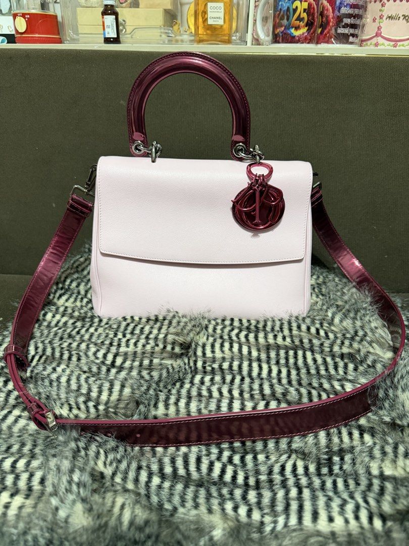 Christian Dior Pink Top Handle Flap Bag (Category: Luxury Bags & Wallets) located in Quezon City. Submitted by parischanelcollection (Listing ID 1466798869, Image 3). Description: - Brand: Dior - Material: Light pink leather with glossy dark pink patent handles and strap - Design: Structured flap closure with a convenient back flat slip pocket - Accents: Iconic dangling Dior charm on the front handle base - Hardware: Finished with bold metallic h