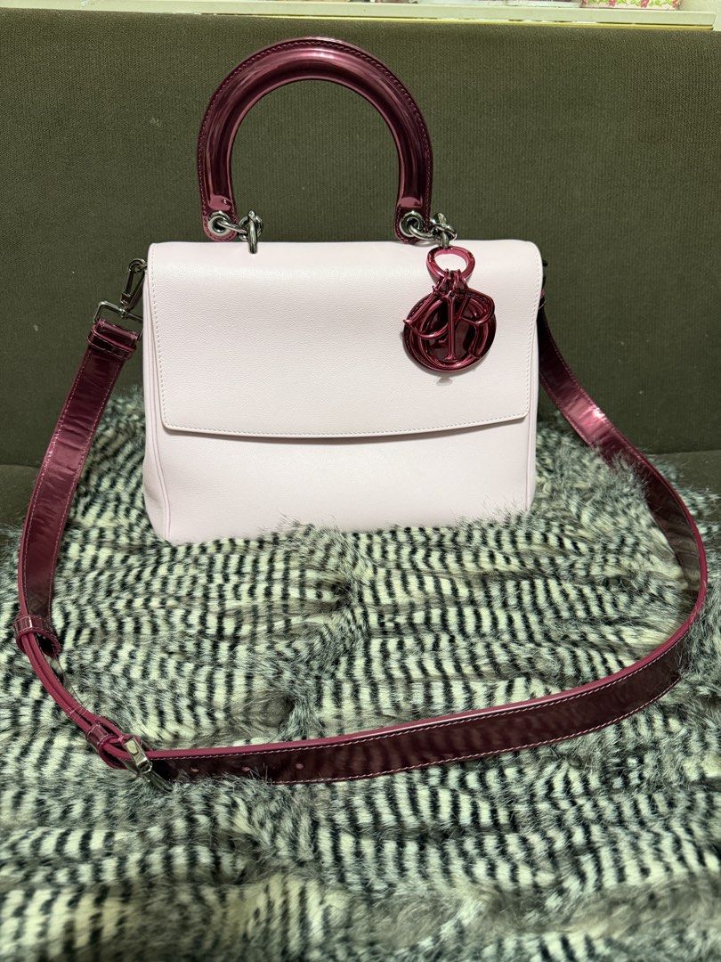 Christian Dior Pink Top Handle Flap Bag (Category: Luxury Bags & Wallets) located in Quezon City. Submitted by parischanelcollection (Listing ID 1466798869, Image 1). Description: - Brand: Dior - Material: Light pink leather with glossy dark pink patent handles and strap - Design: Structured flap closure with a convenient back flat slip pocket - Accents: Iconic dangling Dior charm on the front handle base - Hardware: Finished with bold metallic h