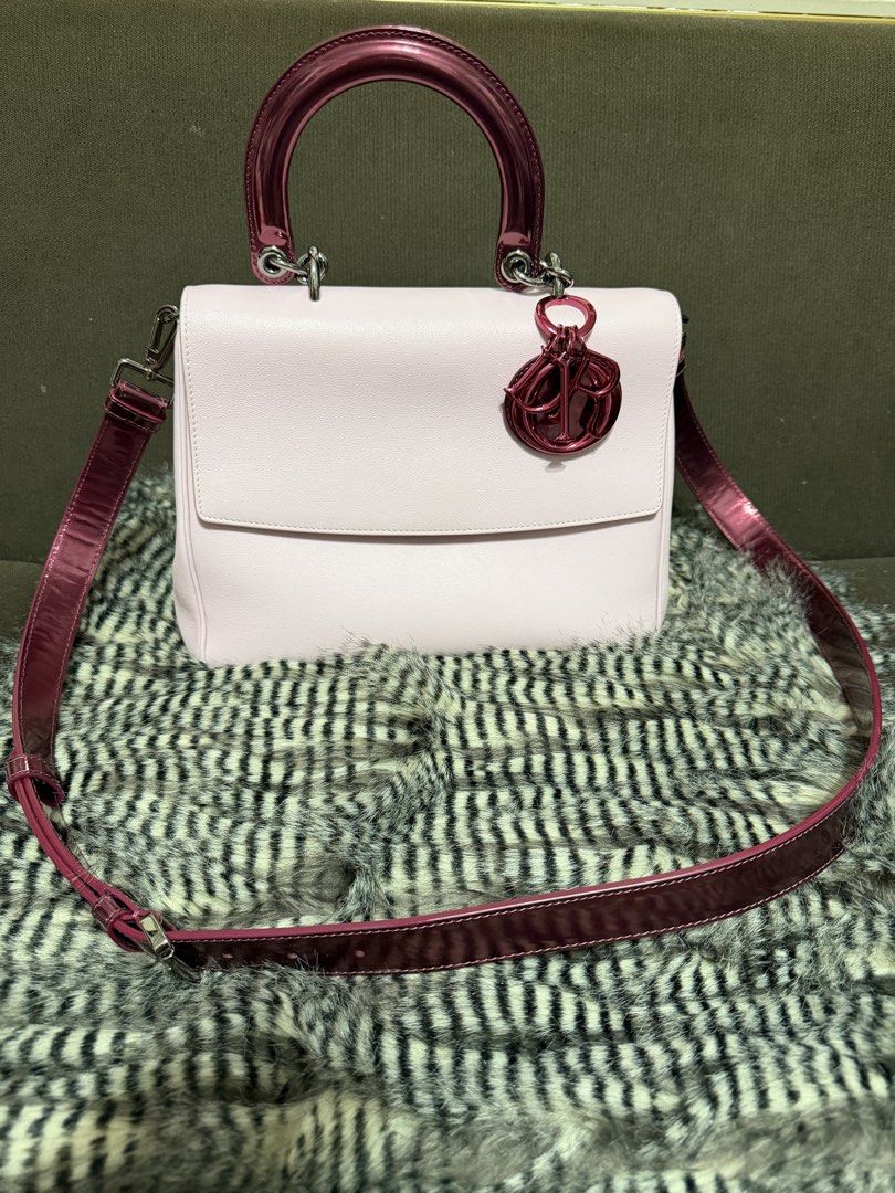 Christian Dior Pink Top Handle Flap Bag (Category: Luxury Bags & Wallets) located in Quezon City. Submitted by parischanelcollection (Listing ID 1466798869, Image 2). Description: - Brand: Dior - Material: Light pink leather with glossy dark pink patent handles and strap - Design: Structured flap closure with a convenient back flat slip pocket - Accents: Iconic dangling Dior charm on the front handle base - Hardware: Finished with bold metallic h