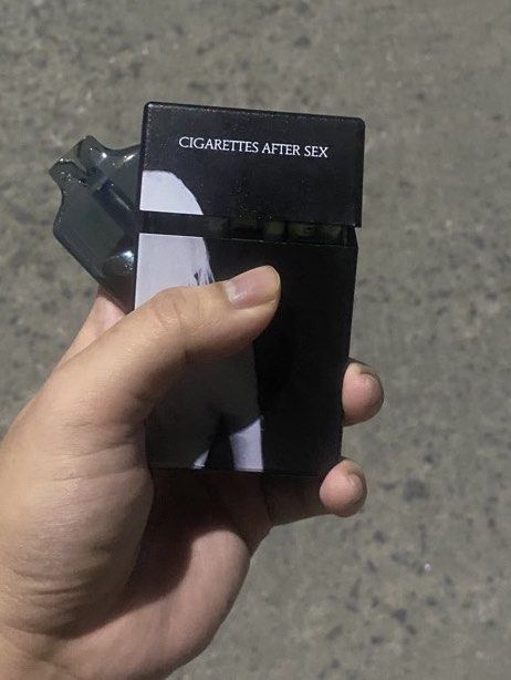 Cigarettes After Sex Black Cigarette Case (Category: Vintage Collectibles) located in Manila. Submitted by yaboidreck (Listing ID 1466822575, Image 2). Description: Cigarettes Box (Cigarettes after Sex)/Multi-Purpose Storage Box Not affiliated to any CAS official Merchandise, Size: 3.82inches in height x 2.48inches in length x 1.14inches in width. Can be used to store: • Cigarettes and a lighter (Can fit whole Pack of Cigarettes • Folded cash and