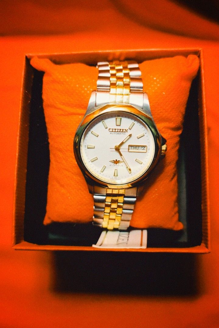 Citizen Eagle 7 Automatic 21 Jewels Two-Tone Watch with Box (Category: Men's Watches) located in Santa Rosa. Submitted by casper_dghost (Listing ID 1466964006, Image 1). Description: - Brand: Citizen Automatic Watch - Dial: Clean white dial with a 3 o'clock day-date window - Movement: Reliable 21 jewels automatic movement - Strap: Elegant gold and silver two-tone jubilee-style bracelet - Condition: Keeps accurate time - Inclusions: Comes complete