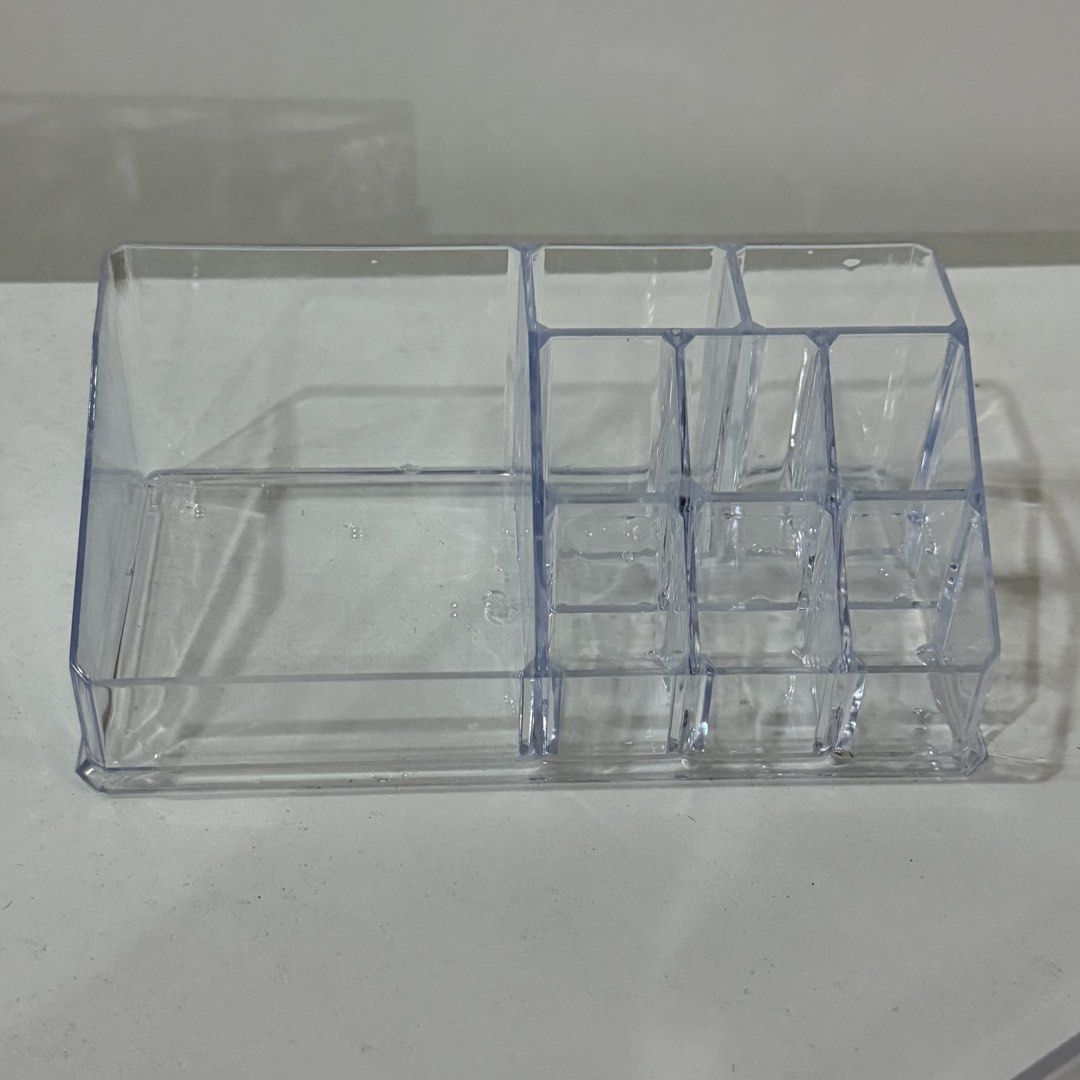 Clear Acrylic Makeup and Cosmetics Storage Organizer Box (Category: Accessory Holder, Box & Organizers) located in Marikina City. Submitted by lovegoeson (Listing ID 1466886664, Image 2). Description: - Clear acrylic desktop organizer for makeup and skincare - Multiple compartments including tall brush slots and lipstick holders - Large open section on the left for big bottles and palettes - Durable, transparent plastic for easy viewing - Keeps v