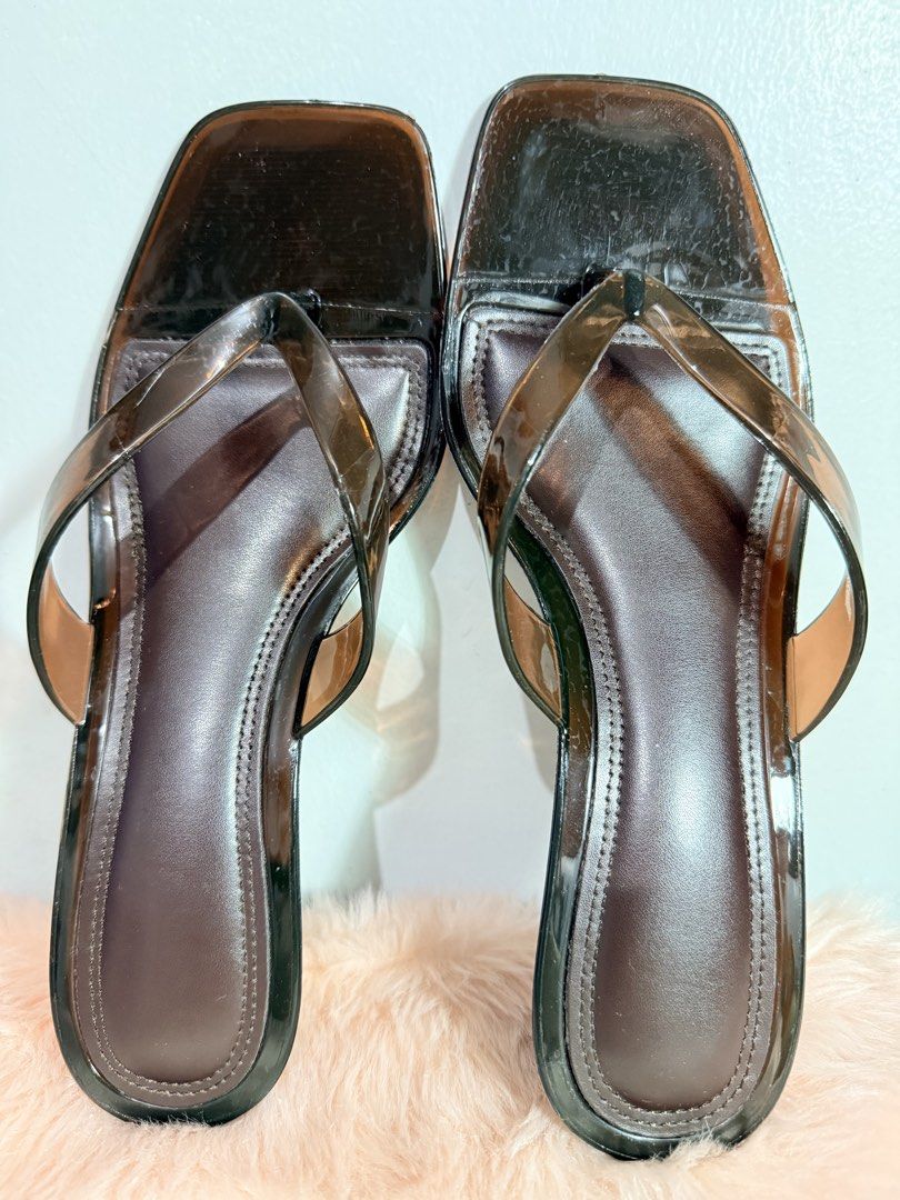 Clear Strap Square Toe Kitten Heel Sandals (Category: Heels) located in Quezon City. Submitted by shaberbree (Listing ID 1466916926, Image 1). Description: Clear strap heels with square toes and thong style design. Brown faux leather footbed with kitten heels. Soles have ribbed texture for grip. Size EUR 37 (US 6, UK 4). Minor scuffs and wear marks on the clear straps and toe box area. Ready to wear..