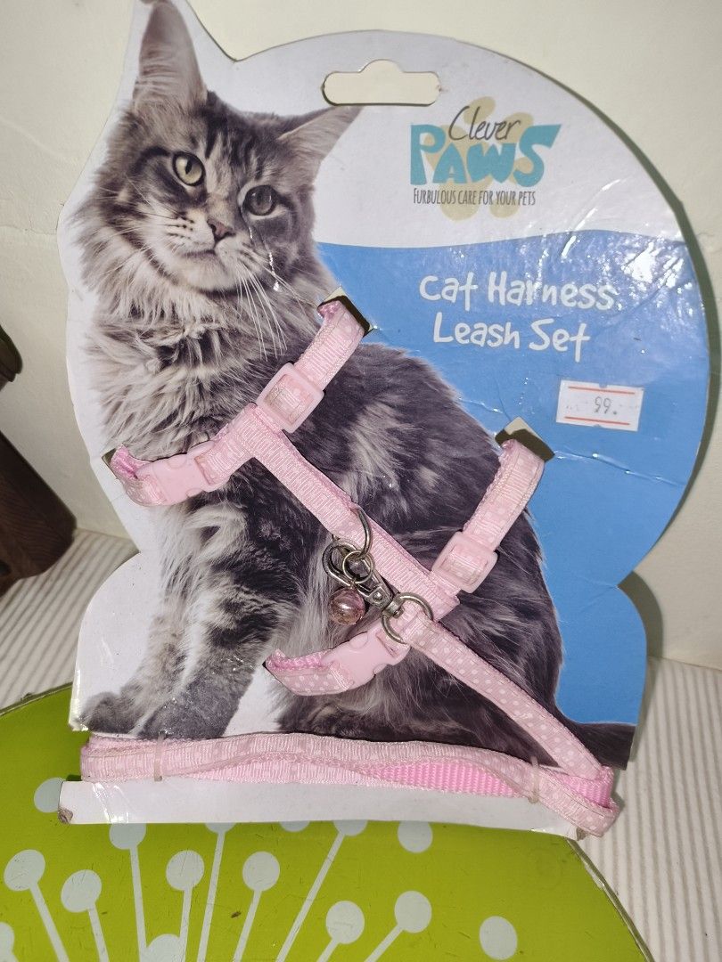 Clever Paws Pink Cat Harness and Leash Set (Category: Sleeveless) located in Manila. Submitted by reascheyss51406 (Listing ID 1466826297, Image 1). Description: Pink cat harness and leash set from Clever Paws. Adjustable straps for a comfy fit, plus a little bell attached. Still attached to the original cardboard packaging, never opened or used..