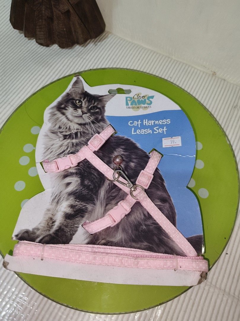 Clever Paws Pink Cat Harness and Leash Set (Category: Sleeveless) located in Manila. Submitted by reascheyss51406 (Listing ID 1466826297, Image 3). Description: Pink cat harness and leash set from Clever Paws. Adjustable straps for a comfy fit, plus a little bell attached. Still attached to the original cardboard packaging, never opened or used..