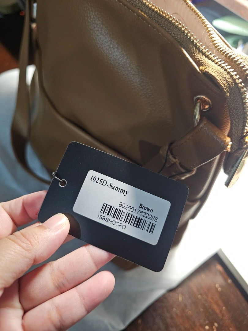 CLN 1025D Sammy Shoulder Bag Brown (Category: Shoulder Bags) located in Paranaque City. Submitted by mizniteowl (Listing ID 1466918217, Image 3). Description: Reason for selling: Not my style. Given as a gift. UNUSED. Description: CLN Sammy shoulder bag in brown. Zip closure on top, extra zip pocket on the back. Gold-tone hardware details. Interior lined with patterned fabric, includes slip and zip compartments. Still has original store tag attac