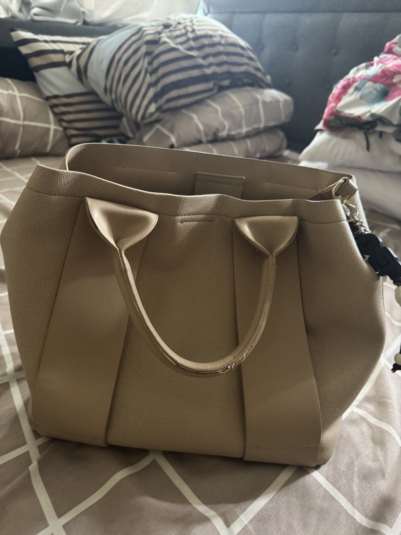 CLN Beige Tote Bag with Dual Straps (Category: Tote Bags) located in Pasay City. Submitted by mchntal (Listing ID 1466830021, Image 2). Description: - Brand: CLN - Color: Classic Beige - Design: Structured tote bag with dual carrying straps - Features: Spacious interior with zippered compartments and snap closure - Condition: Excellent pre-loved condition - Meet-up Location: Buendia FX Terminal, Pasay City.