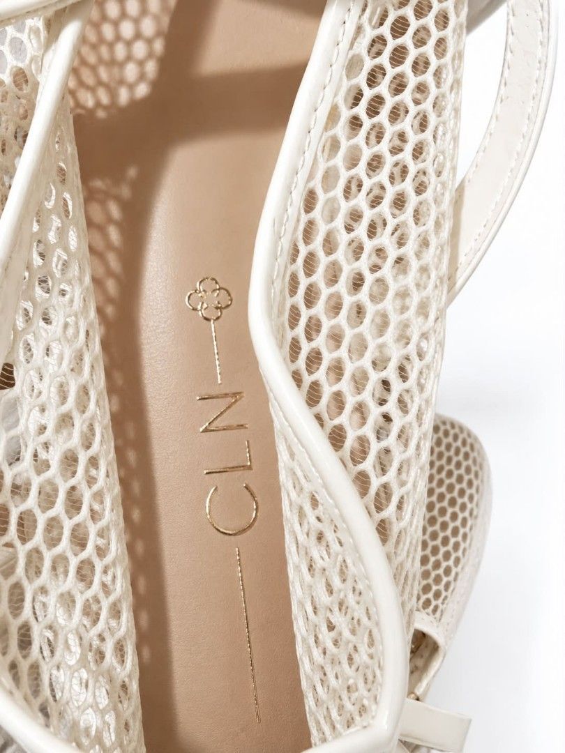 CLN Mesh Mary Jane Flats White Size (Category: Flats & Sandals) located in San Jose del Monte. Submitted by Skin_Care2022 (Listing ID 1466800961, Image 2). Description: - Brand: CLN - Style: White mesh Mary Jane flats with trendy patent straps and gold-tone buckle - Comfort: Lightweight design with a neutral tan insole and gold logo stamping - Condition: Clean soles and crisp white material - Perfect for: Everyday casual wear.