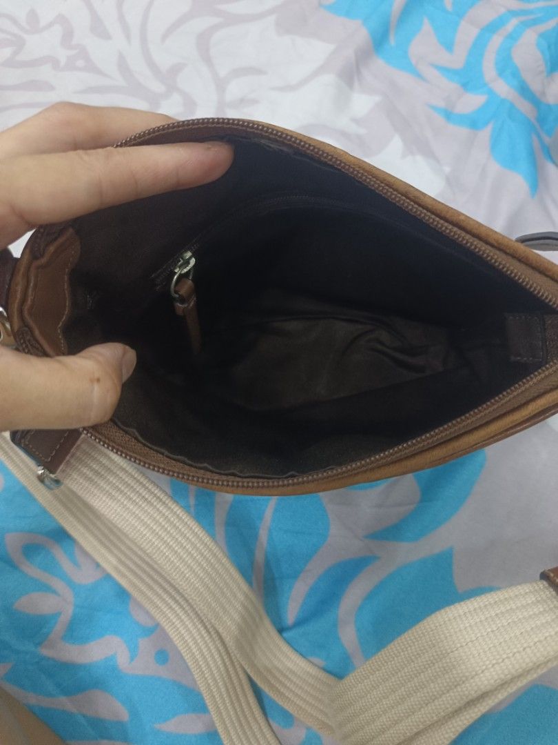 Coach Beige Brown Crossbody Bag (Category: Luxury Bags & Wallets) located in Quezon City. Submitted by ochea28 (Listing ID 1466884239, Image 3). Description: - Authentic Coach crossbody bag - Signature beige and brown canvas with brown leather trim - Top zip closure for security - Exterior front open slip pocket - Adjustable canvas shoulder strap - Dark fabric interior lining with a convenient zip pocket - Dimensions: approx. 20 cm (H) x 23 cm (W