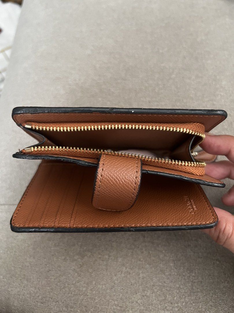 Coach Brown Leather Medium Zip Around Wallet (Category: Luxury Bags & Wallets) located in Santa Rosa. Submitted by etjam (Listing ID 1466800712, Image 2). Description: Brown leather Coach wallet with multiple card slots and an ID window. Includes cash compartment and zip coin pouch. Secure snap closure keeps everything in place. Classic saddle brown colour matches most bags. Compact size fits easily in everyday purses..