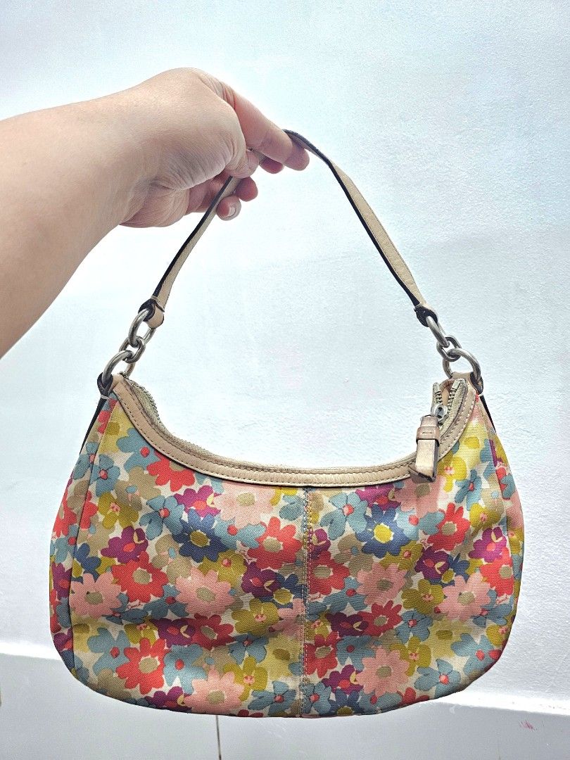 Coach multi-color floral demi hobo (Category: Shoulder Bags) located in Manila. Submitted by shopaholicmimi (Listing ID 1466955554, Image 2). Description: 📍preloved with flaws (please see photos) rare style not ergo, legacy, vintage, soho, saddle, zoe, carly, eastwest, patchwork, rare, canvas, signature, laurel, kili.