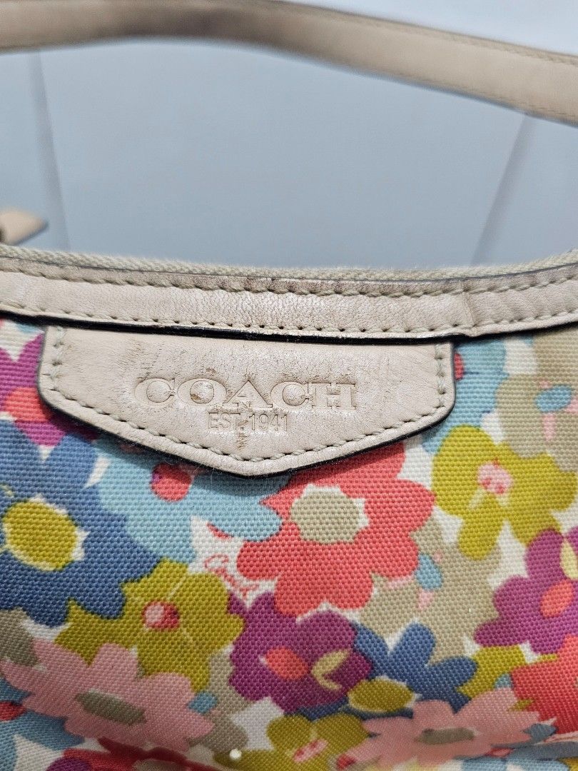 Coach multi-color floral demi hobo (Category: Shoulder Bags) located in Manila. Submitted by shopaholicmimi (Listing ID 1466955554, Image 3). Description: 📍preloved with flaws (please see photos) rare style not ergo, legacy, vintage, soho, saddle, zoe, carly, eastwest, patchwork, rare, canvas, signature, laurel, kili.