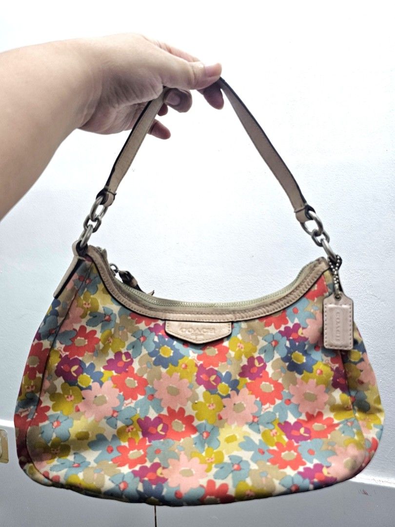 Coach multi-color floral demi hobo (Category: Shoulder Bags) located in Manila. Submitted by shopaholicmimi (Listing ID 1466955554, Image 1). Description: 📍preloved with flaws (please see photos) rare style not ergo, legacy, vintage, soho, saddle, zoe, carly, eastwest, patchwork, rare, canvas, signature, laurel, kili.