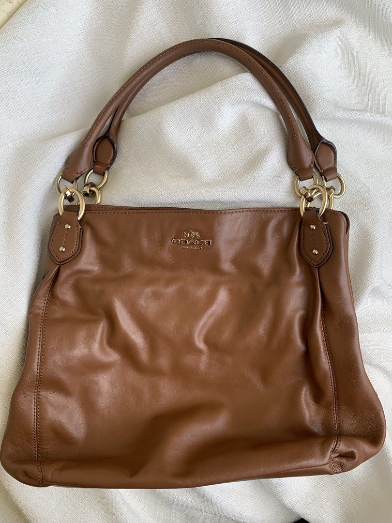 Coach saddle brown (Category: Shoulder Bags) located in Bulacan. Submitted by bliselda (Listing ID 1466817018, Image 1). Description: Coach saddle brown 🐻🍂 issue: see provided picture for more details ng bag pa zoom nalang the rest maganda pa sya sa personal.