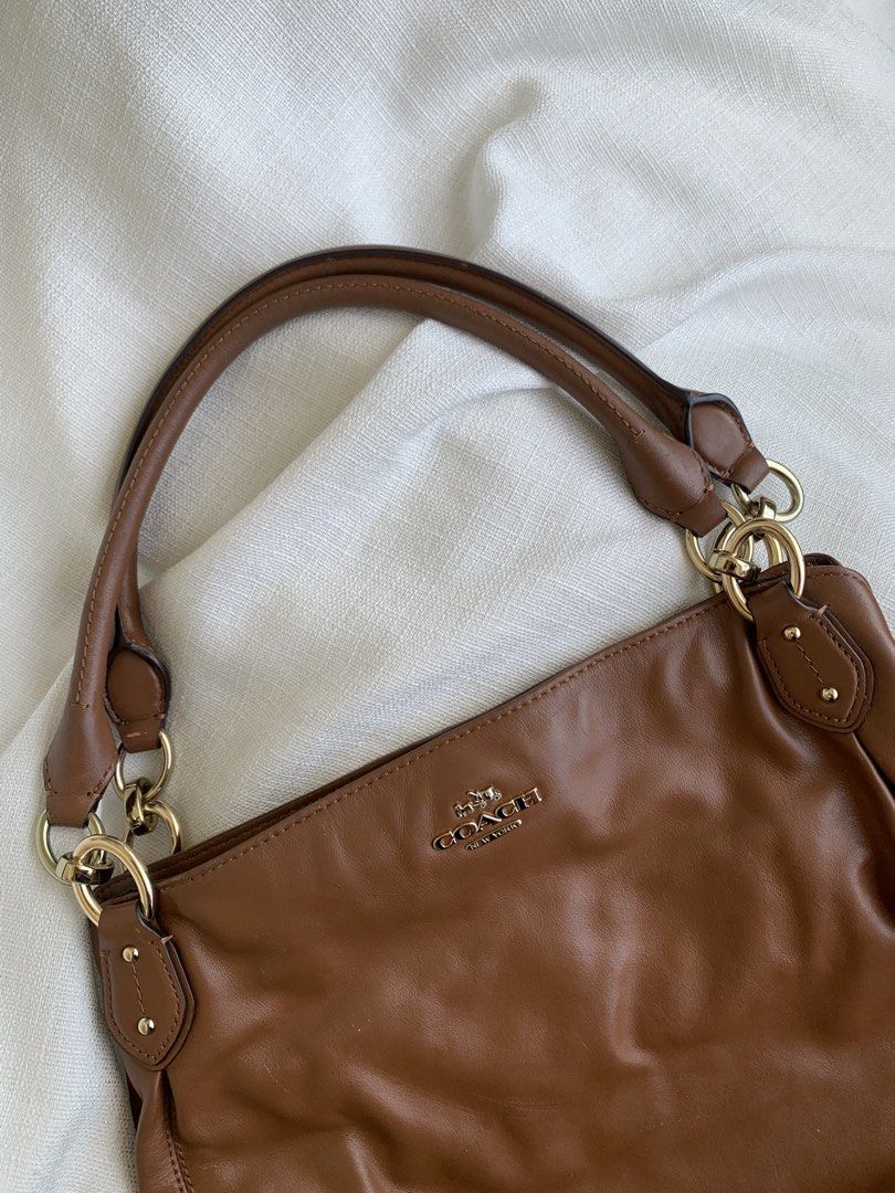 Coach saddle brown (Category: Shoulder Bags) located in Bulacan. Submitted by bliselda (Listing ID 1466817018, Image 2). Description: Coach saddle brown 🐻🍂 issue: see provided picture for more details ng bag pa zoom nalang the rest maganda pa sya sa personal.
