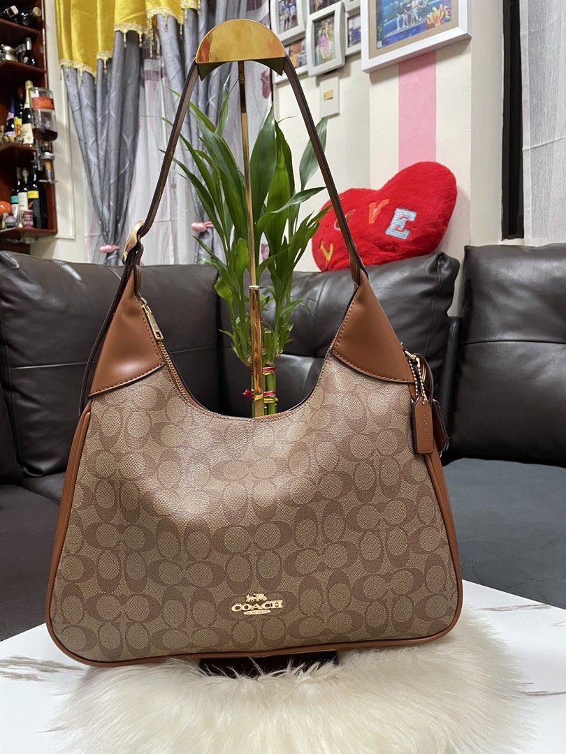 Coach Shoulder Bag (Category: Shoulder Bags) located in Mandaue City. Submitted by ludz_0246 (Listing ID 1466907912, Image 1). Description: Ykk Zipper Etekita In mono brown Medium Size Adjustable Strap Good as new condition .