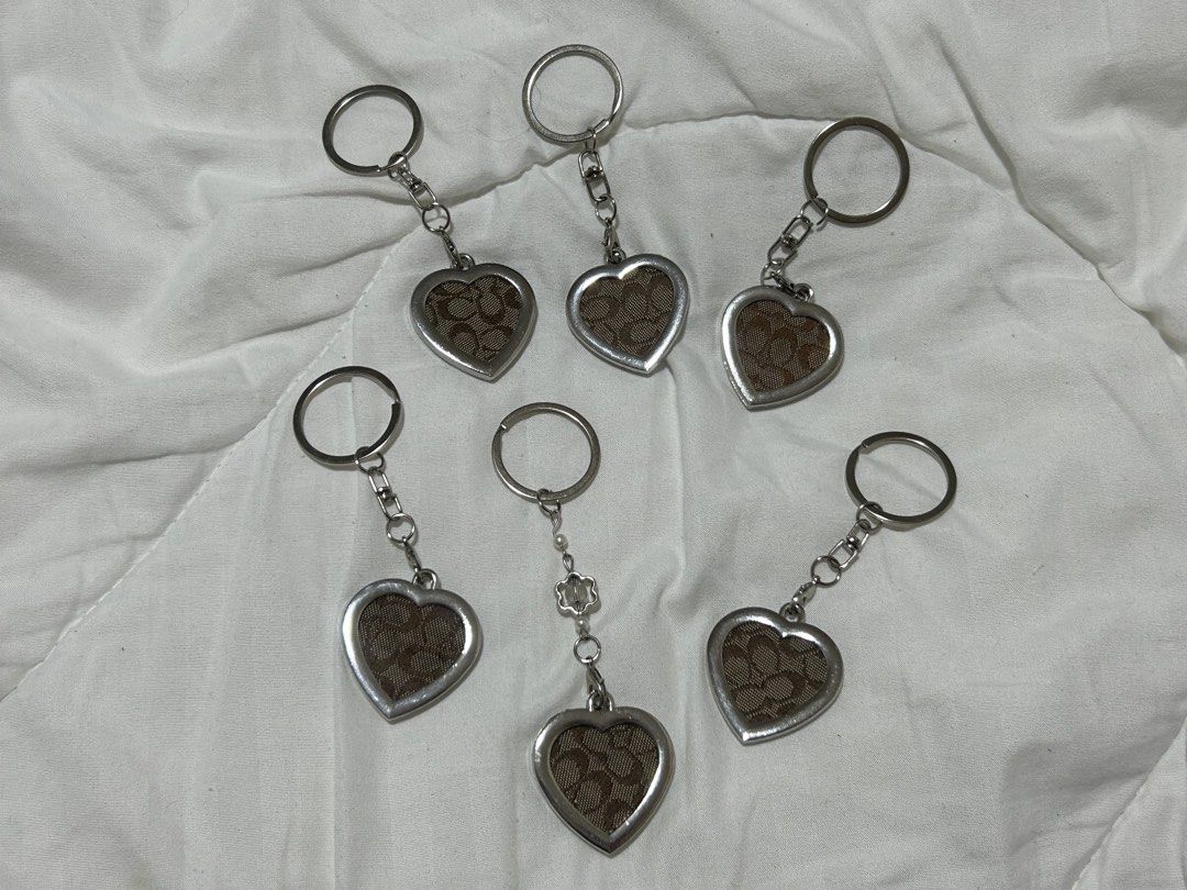 Coach Signature C Heart Keychain (Category: Wallets & Card holders) located in Santa Rita. Submitted by chloeclosette (Listing ID 1466801368, Image 1). Description: - Material/Design: Signature C canvas in brown with silver hardware great for bags and keys Made out of auth coach project bag! Loc- Pampanga.