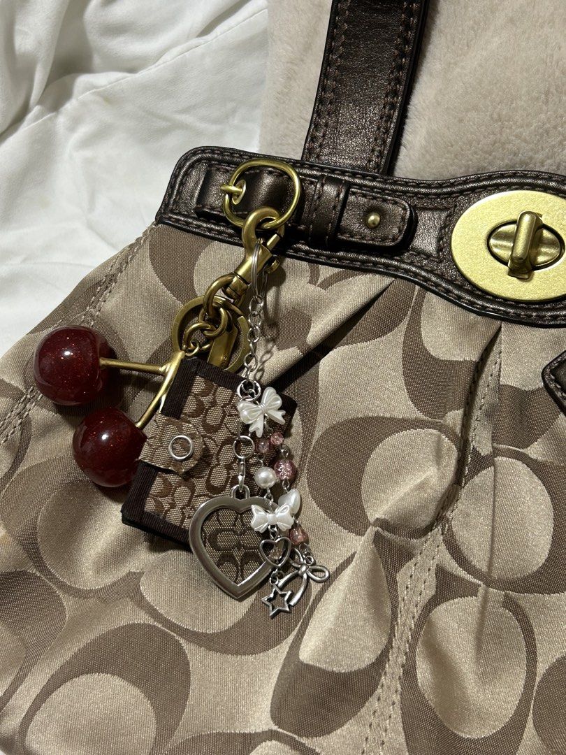 Coach Signature C Heart Keychain (Category: Wallets & Card holders) located in Santa Rita. Submitted by chloeclosette (Listing ID 1466801368, Image 3). Description: - Material/Design: Signature C canvas in brown with silver hardware great for bags and keys Made out of auth coach project bag! Loc- Pampanga.