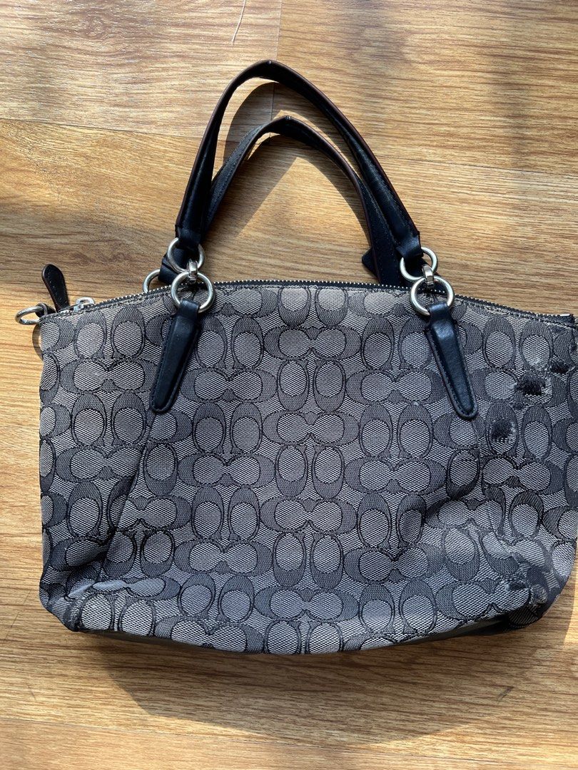 Coach Signature C Monogram Shoulder Bag (Category: Luxury Bags & Wallets) located in Manila. Submitted by lykshome (Listing ID 1466775628, Image 2). Description: - Brand: Coach - Model: Signature C Monogram Shoulder Bag - Color: Black and Grey - Material: Signature fabric with leather trim - Closure: Secure top zipper - Interior: Fabric-lined with inner zip and slip pockets - Condition: Pre-loved with visible wear/flaws on the exterior fabric as 