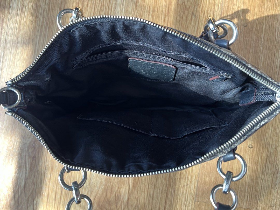 Coach Signature C Monogram Shoulder Bag (Category: Luxury Bags & Wallets) located in Manila. Submitted by lykshome (Listing ID 1466775628, Image 3). Description: - Brand: Coach - Model: Signature C Monogram Shoulder Bag - Color: Black and Grey - Material: Signature fabric with leather trim - Closure: Secure top zipper - Interior: Fabric-lined with inner zip and slip pockets - Condition: Pre-loved with visible wear/flaws on the exterior fabric as 