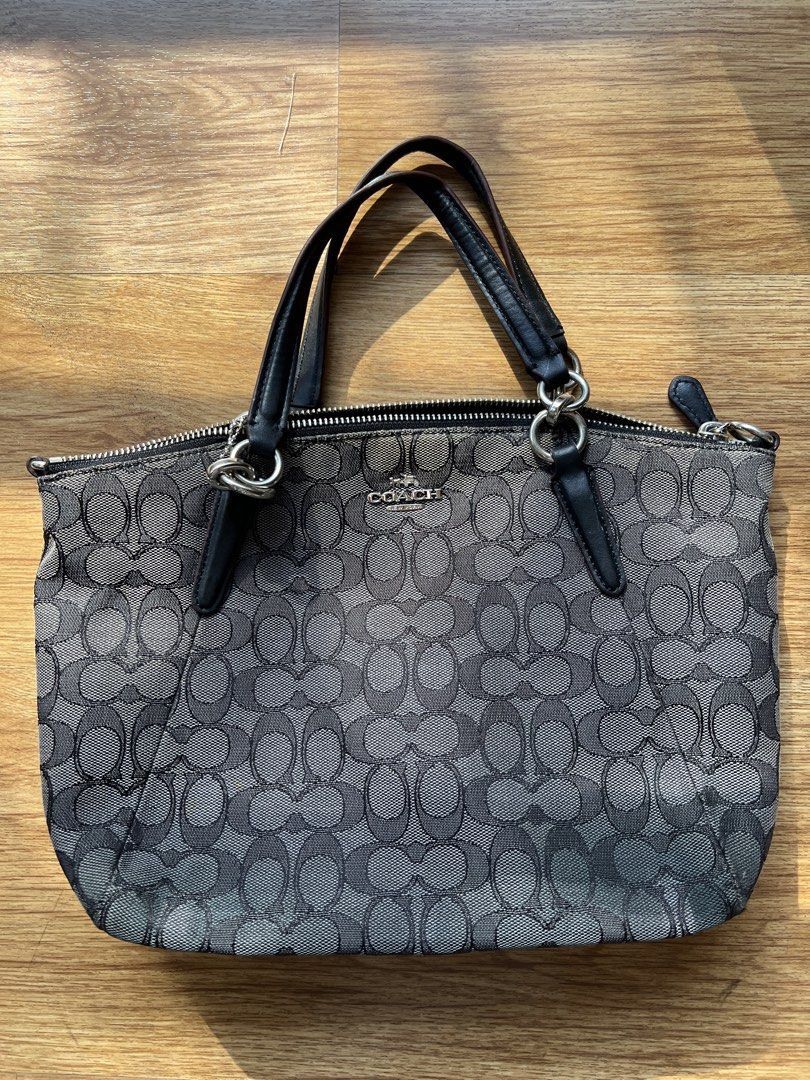 Coach Signature C Monogram Shoulder Bag (Category: Luxury Bags & Wallets) located in Manila. Submitted by lykshome (Listing ID 1466775628, Image 1). Description: - Brand: Coach - Model: Signature C Monogram Shoulder Bag - Color: Black and Grey - Material: Signature fabric with leather trim - Closure: Secure top zipper - Interior: Fabric-lined with inner zip and slip pockets - Condition: Pre-loved with visible wear/flaws on the exterior fabric as 