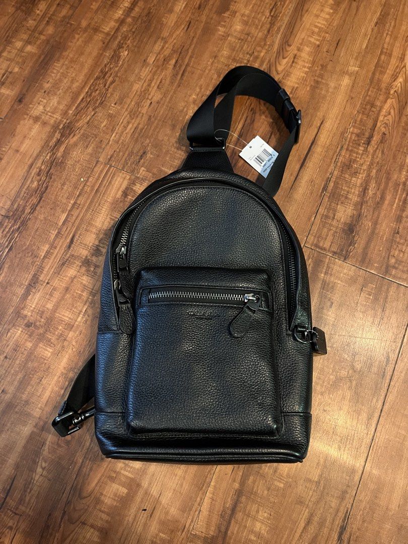 Coach West Pack Pebbled Leather Black Sling Bag (Category: Luxury Bags & Wallets) located in Taguig. Submitted by kscsantos (Listing ID 1466837806, Image 2). Description: - Authentic Coach West Pack (Model 2540) - Color: Classic black in premium pebbled leather with gunmetal hardware - Storage: Front zipped pocket, main zip compartment, interior story patch, and slip pocket - Comfort: Breathable mesh back panel and bottom D-rings for adjustable s