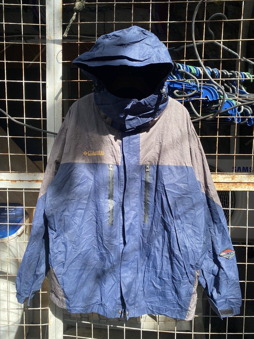Columbia Titanium Omni-Tech Waterproof Hooded Jacket (Category: Coats, Jackets and Outerwear) located in Abulug. Submitted by axeldot (Listing ID 1466867702, Image 1). Description: - Brand: Columbia Titanium - Color: Blue and Grey - Size: Small - Material/Tech: Omni-Tech breathable ceramic technology with fully seam-sealed construction - Features: Hooded design, zippered chest pockets, hook-and-loop adjustable sleeve cuffs, and comfortable interi