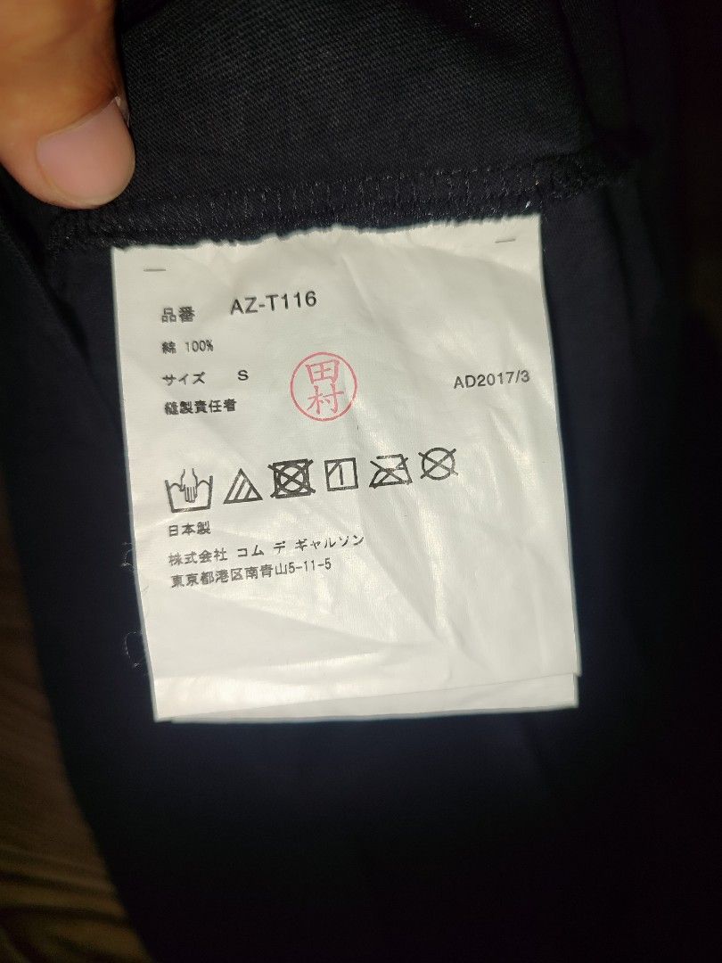 COMME des GARÇONS PLAY Black Heart Tee Size S (Category: Shirts) located in Davao. Submitted by valeriajan24414 (Listing ID 1466847549, Image 3). Description: - Brand: COMME des GARÇONS PLAY - Size: S - Material: 100% Cotton - Origin: Made in Japan - Design: Large white heart graphic with signature embroidered red heart patch - Details: Classic crew neck, short sleeves, model code AZ-T116 - Collection: AD2017 tag inside - Condition: 100% authenti