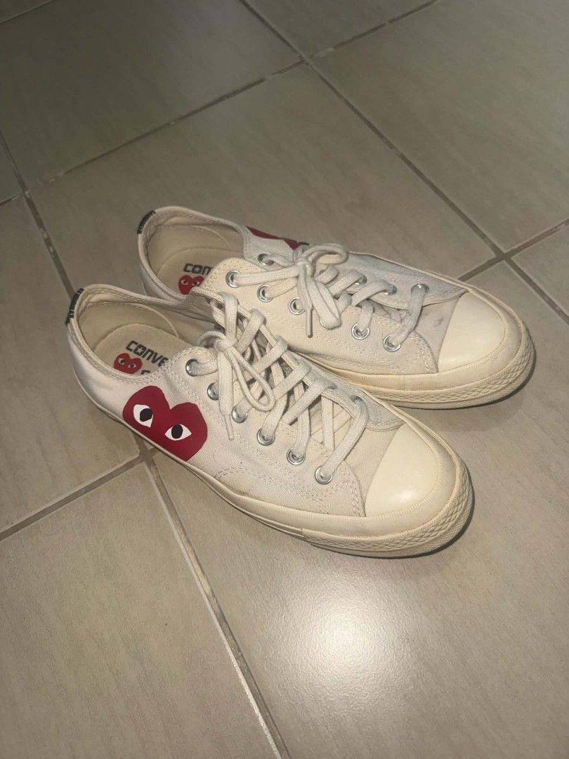 Comme des Garçons Play x Converse Chuck 70 Low White (Category: Sneakers) located in Manila. Submitted by aly.arca (Listing ID 1466864664, Image 2). Description: Converse cdg white size US women’s 9/ 25.5cm - needs cleaning - Brand: Comme des Garçons Play x Converse - Model: Low-top Chuck 70 in White Canvas - Design: Iconic red heart logo on side panel, cream rubber midsoles, and silver metal eyelets - Details: Classic lace-up front with Converse