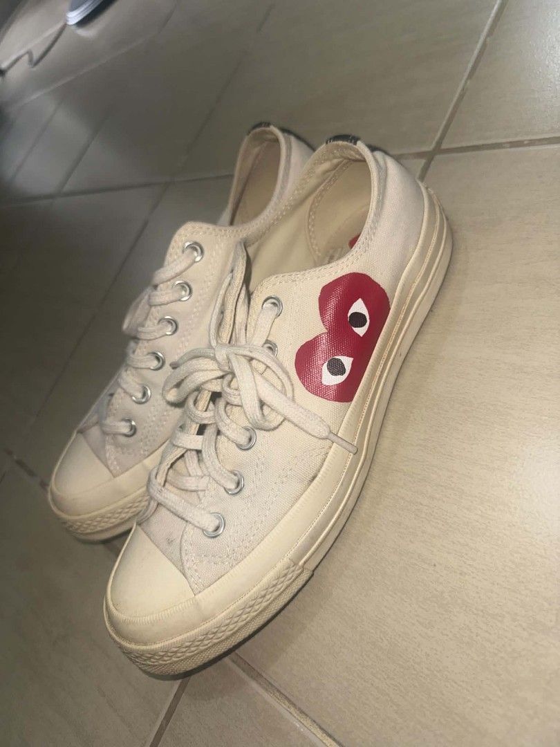 Comme des Garçons Play x Converse Chuck 70 Low White (Category: Sneakers) located in Manila. Submitted by aly.arca (Listing ID 1466864664, Image 1). Description: Converse cdg white size US women’s 9/ 25.5cm - needs cleaning - Brand: Comme des Garçons Play x Converse - Model: Low-top Chuck 70 in White Canvas - Design: Iconic red heart logo on side panel, cream rubber midsoles, and silver metal eyelets - Details: Classic lace-up front with Converse
