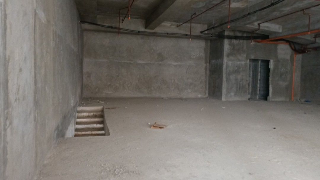 Commercial Space CBD ORTIGAS Pasig City (Category: Construction & Building Materials) located in Manila. Submitted by jo.caro1 (Listing ID 1466925850, Image 1). Description: Unfurnished commercial unit on the ground floor. Large open layout with raw concrete walls, high ceilings, and exposed pipes. Large glass storefront windows facing the street. Staircase leading down to a lower level area. Lots of natural light from the front facade. Great loc