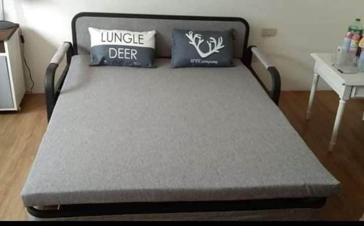 Convertible Sofa Bed Pull Out Bed With Pillows (Category: Sofas) located in Manila. Submitted by jamfrimzy089458 (Listing ID 1466836844, Image 2). Description: - 2-in-1 convertible design: easily transforms from a stylish couch into a comfortable bed-with storage - Sturdy build featuring a strong metal frame with supportive wooden slats - Includes two matching accent pillows - Available in 2 versatile colors: Dark Grey and Light Grey - Offered in