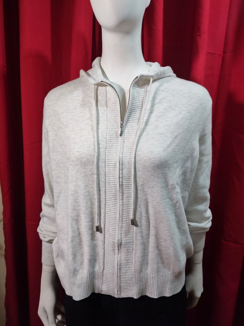 Cream Zip-Up Knit Hoodie with Drawstrings (Category: Coats, Jackets and Outerwear) located in Caloocan City. Submitted by jel_gielle (Listing ID 1466937276, Image 2). Description: - Colour: Cream (Neutral tone) - Material: Soft knit fabric - Fit: Relaxed everyday layering piece - Closure: Full front zipper - Features: Ribbed cuffs, hem, and front placket - Accents: Long drawstrings with metallic silver tips - Styling: Easily pairs with jeans or l