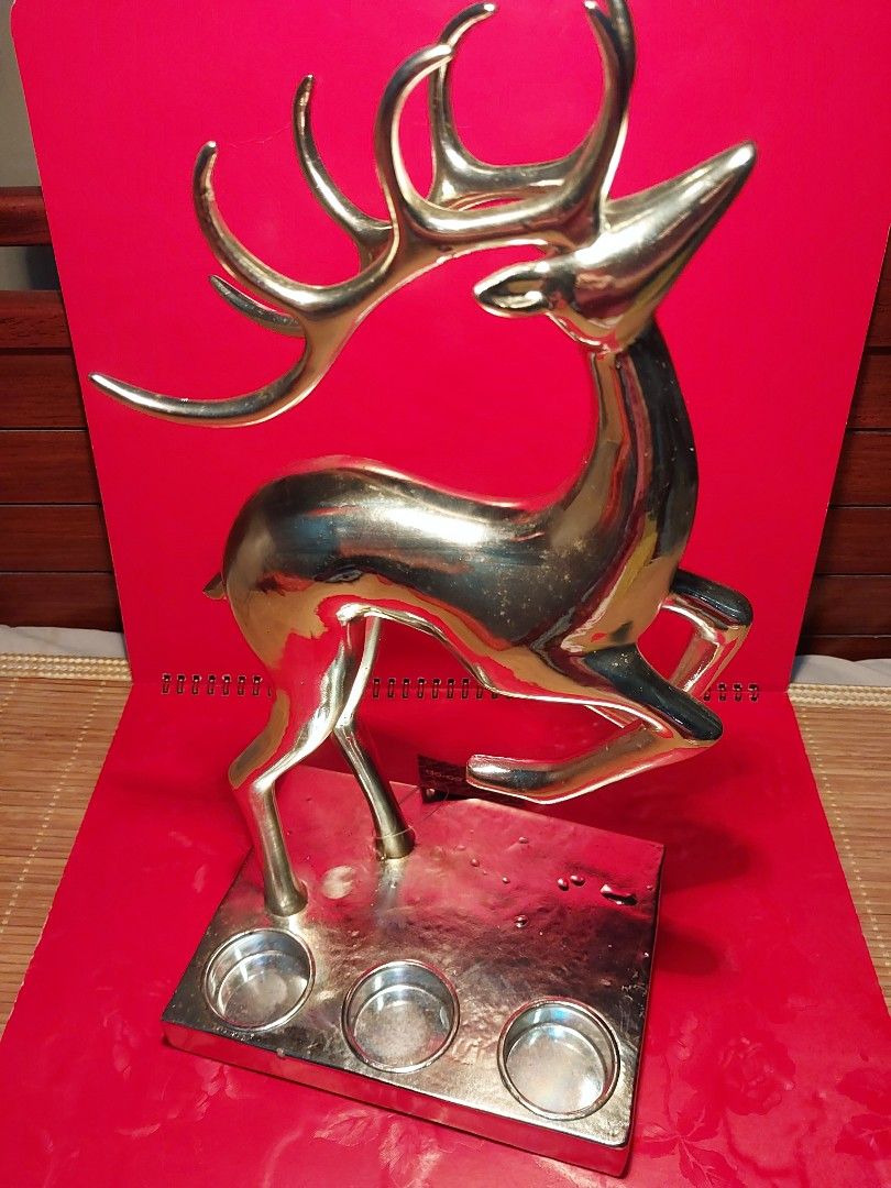 Vintage Deer Sculpture with 3 tealight cups (Category: Figurines & Statues) located in Manila. Submitted by bryantoyshop (Listing ID 1466827665, Image 1). Description: height : 15 inches weight : 1 kg - Unique vintage silver deer figurine - Functions as a candle holder for 3 tealights - Perfect statement piece for tables or shelves.
