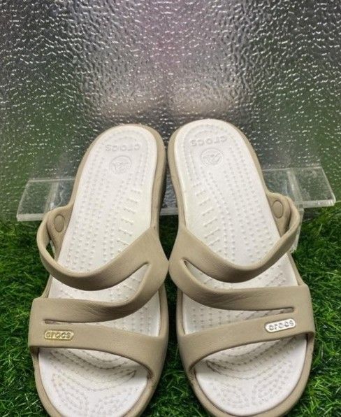 Crocs beige multi-strap sandals comfortable slip-ons (Category: Flats & Sandals) located in Manila. Submitted by nel_besario.1992 (Listing ID 1466859094, Image 1). Description: - Brand: Crocs - Color: Beige with white textured footbed - Style: Open toe, multi-strap slip-on - Features: Small metallic gold logo badge, non-slip textured footbed for extra comfort - Condition: Clean and ready to wear - Perfect for daily casual use.